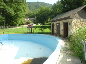 Swimming Pool and Bath House. View of pool painted in blue.